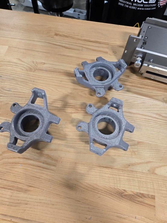 3d metal printed parts showing an intricate design for a racing rim bracket